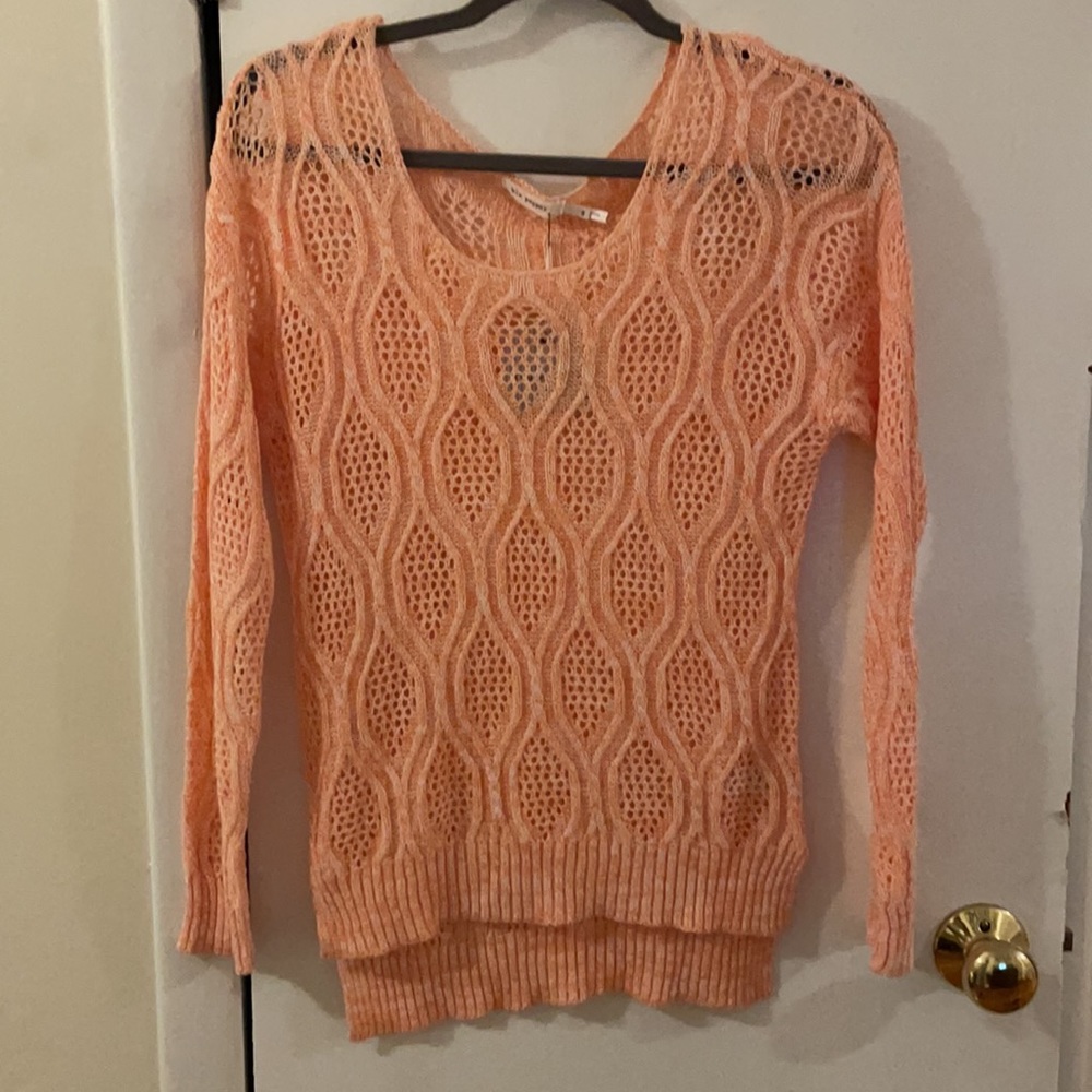 Beautiful lace-like knit top.